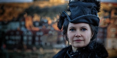 Lady in black with Whitby church in background