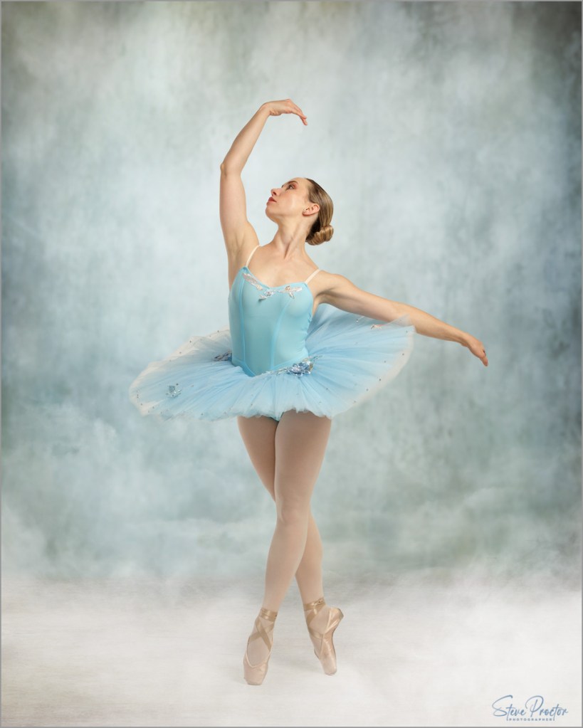 Ballerina in light blue tutu posed in textured style